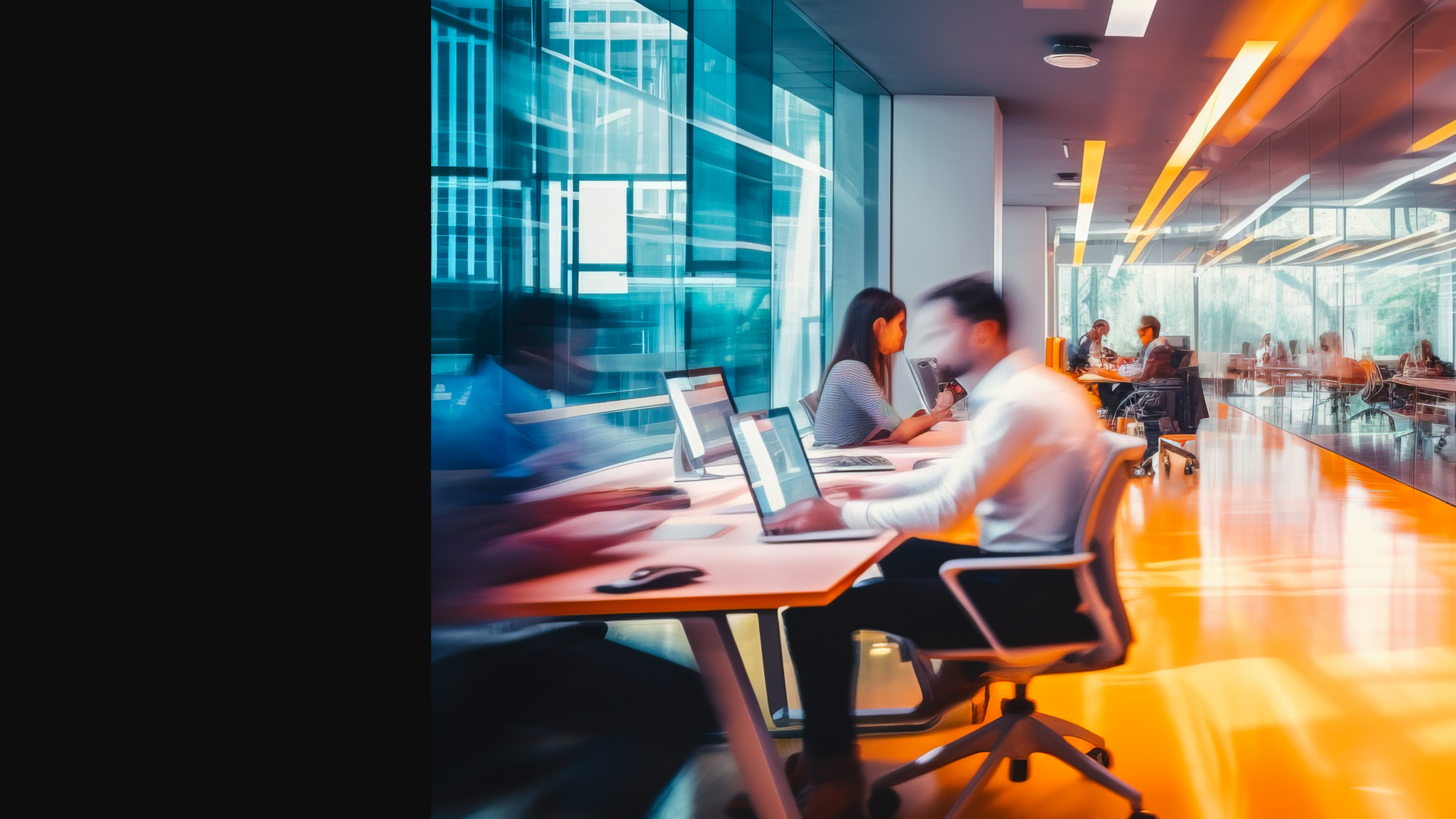 People working on laptops and having discussions in a modern office space with large windows and bright orange flooring. Description generated by AI